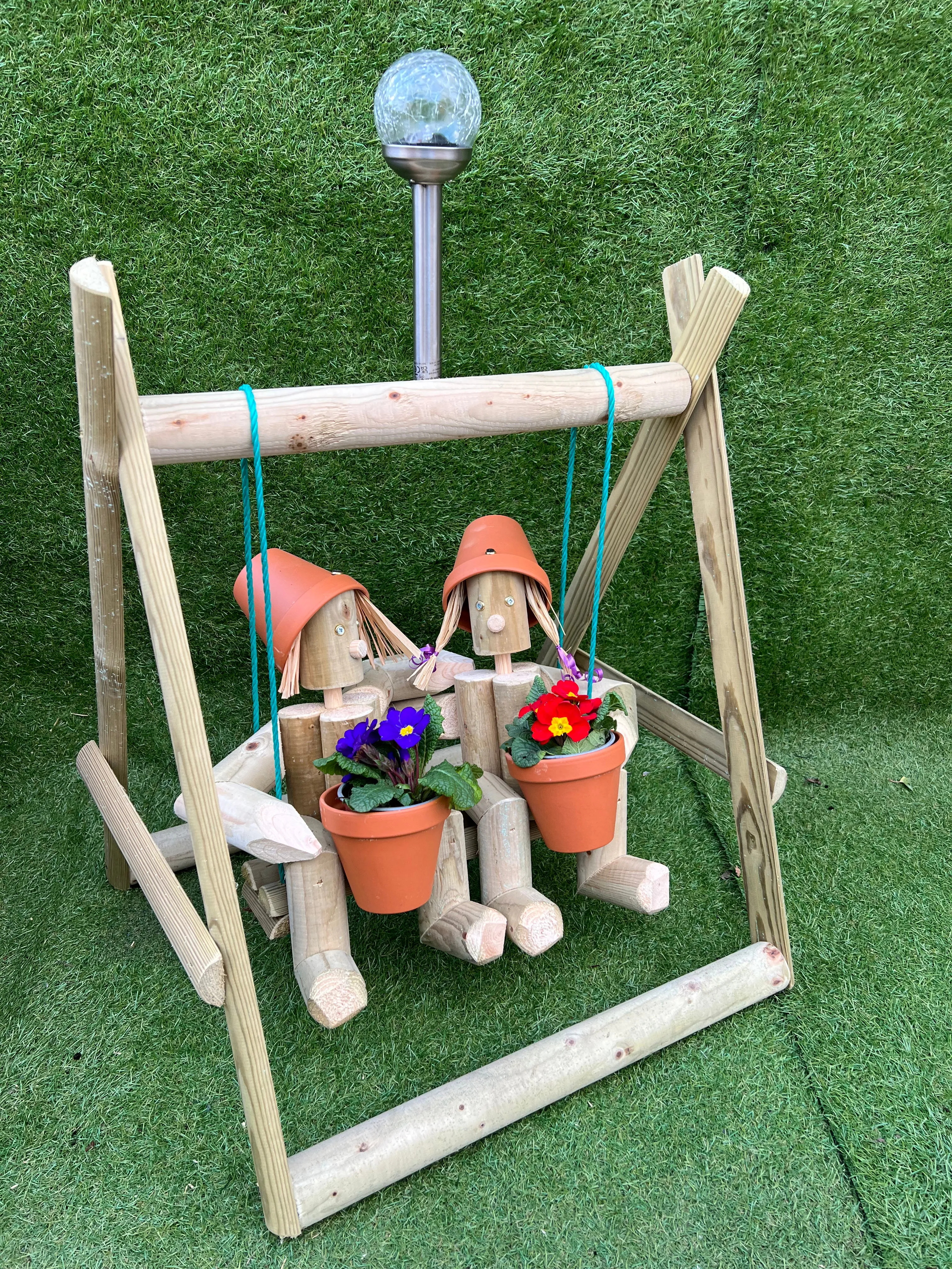 Couple on a swing with a solar light