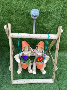 Couple on a swing with a solar light