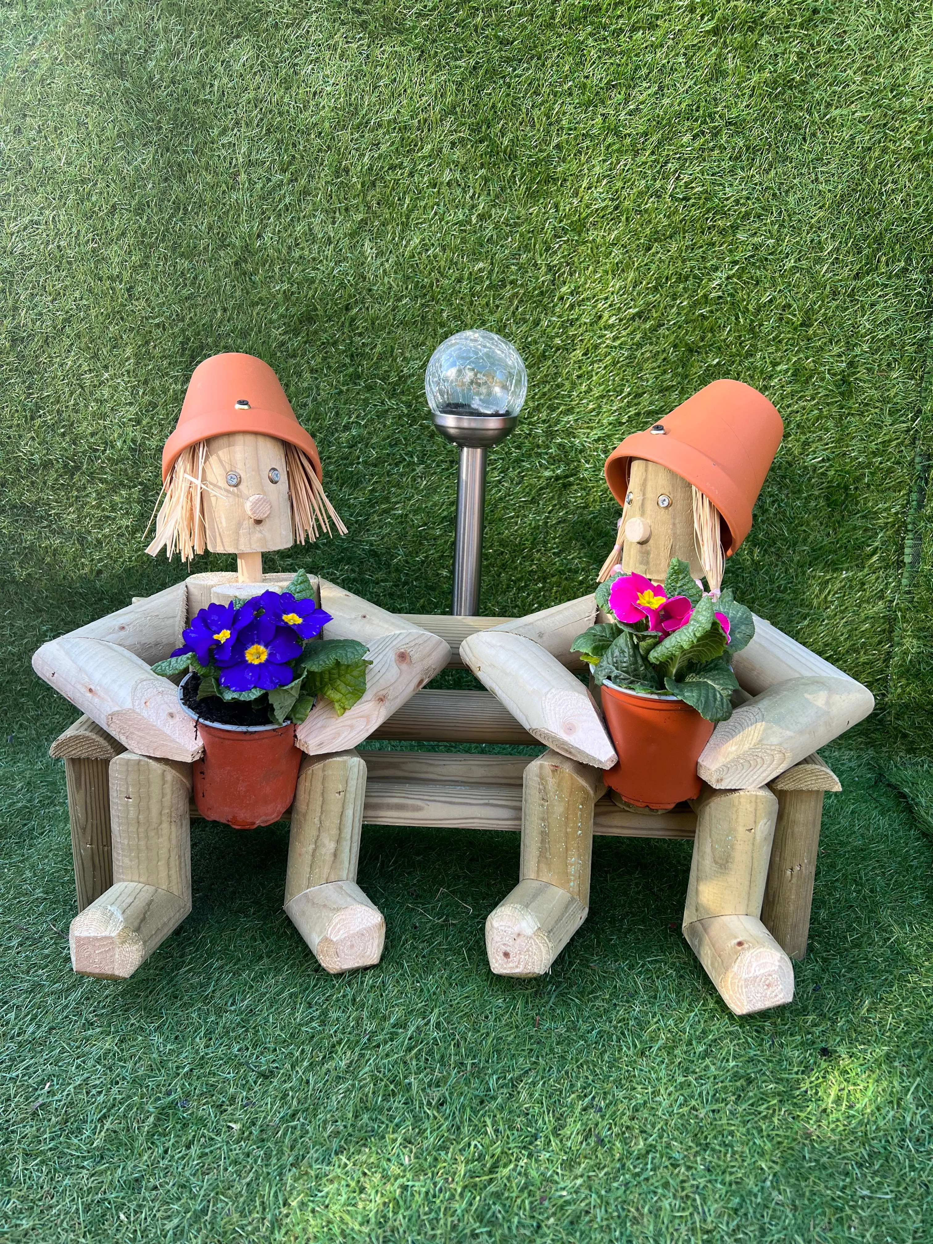 Couple sitting on a bench with solar light